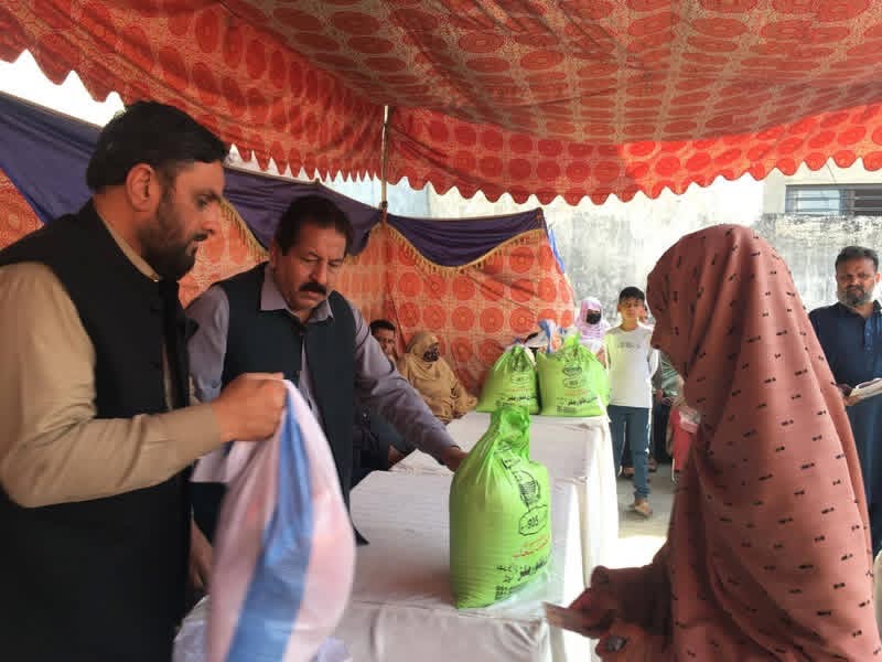 Message Welfare Society team handing food parcels directly to families